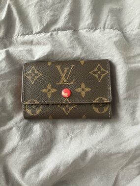 Louis Vuitton Monogram Canvas Compact Wallet in Brown with Red Snap